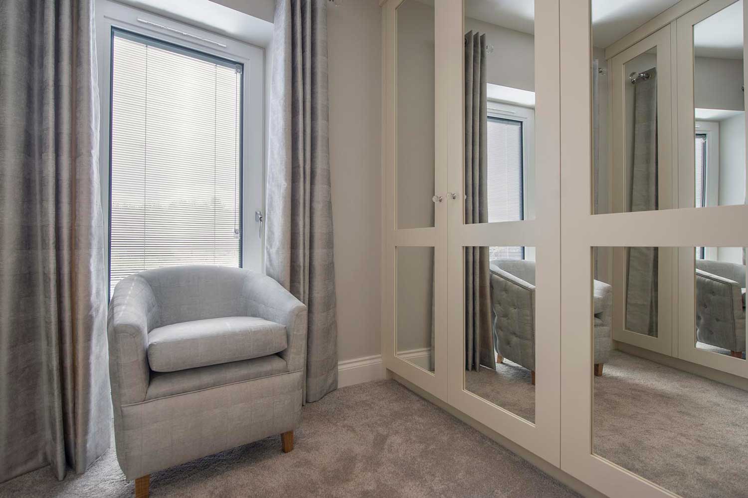 Blinds in Glass in Hatfield: integral blinds in a dressing-room window beside mirrored wardrobes
