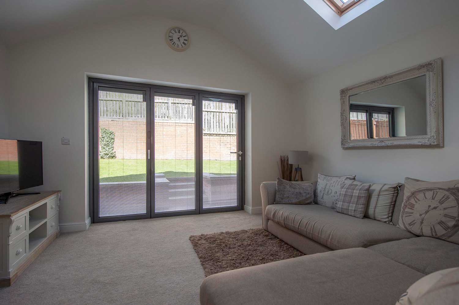 Blinds in Glass in Hatfield: integral blinds in living-room bifold doors below a skylight