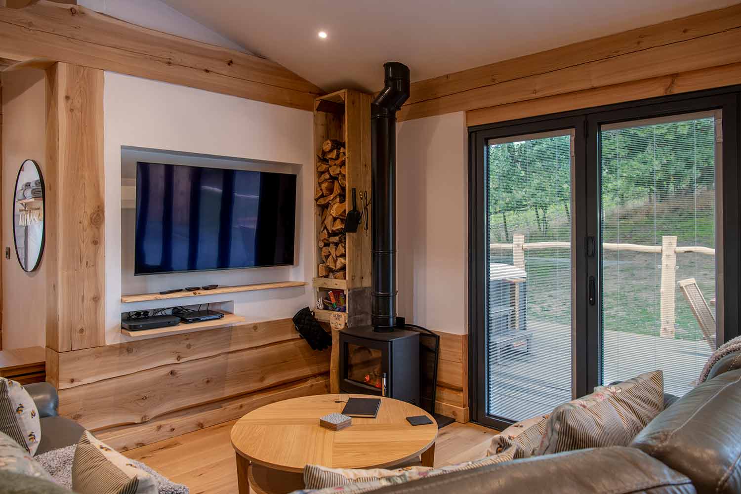 Blinds in Glass in Hatfield: integral blinds in lodge sliding doors beside a wood burner