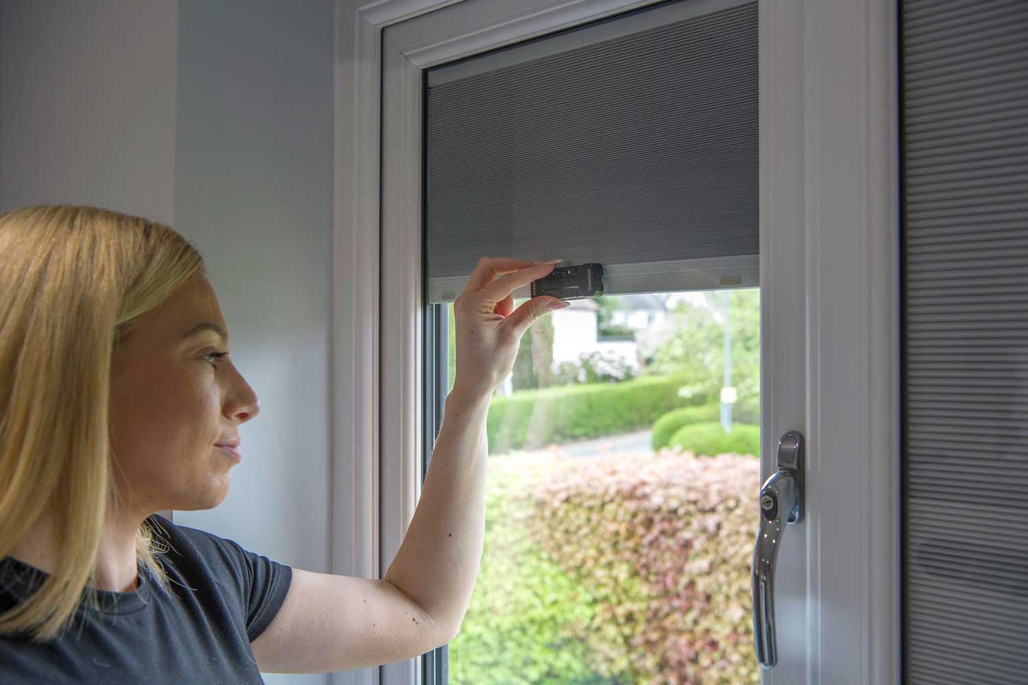 Blinds in Glass in Hatfield: adjusting an integral blind with a manual slider control