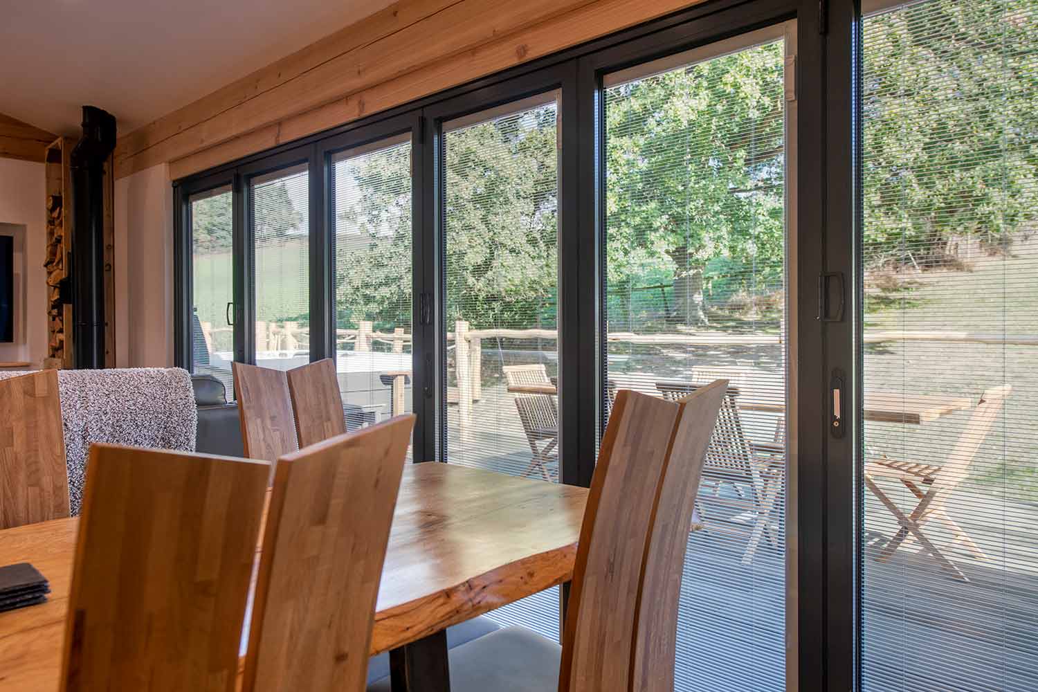 Blinds in Glass in Hatfield: integral blinds in anthracite bifold doors off an oak dining area