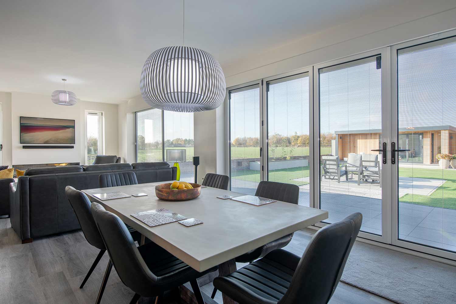 Blinds in Glass in Hatfield: integral blinds in open-plan bifold and French doors with a countryside view