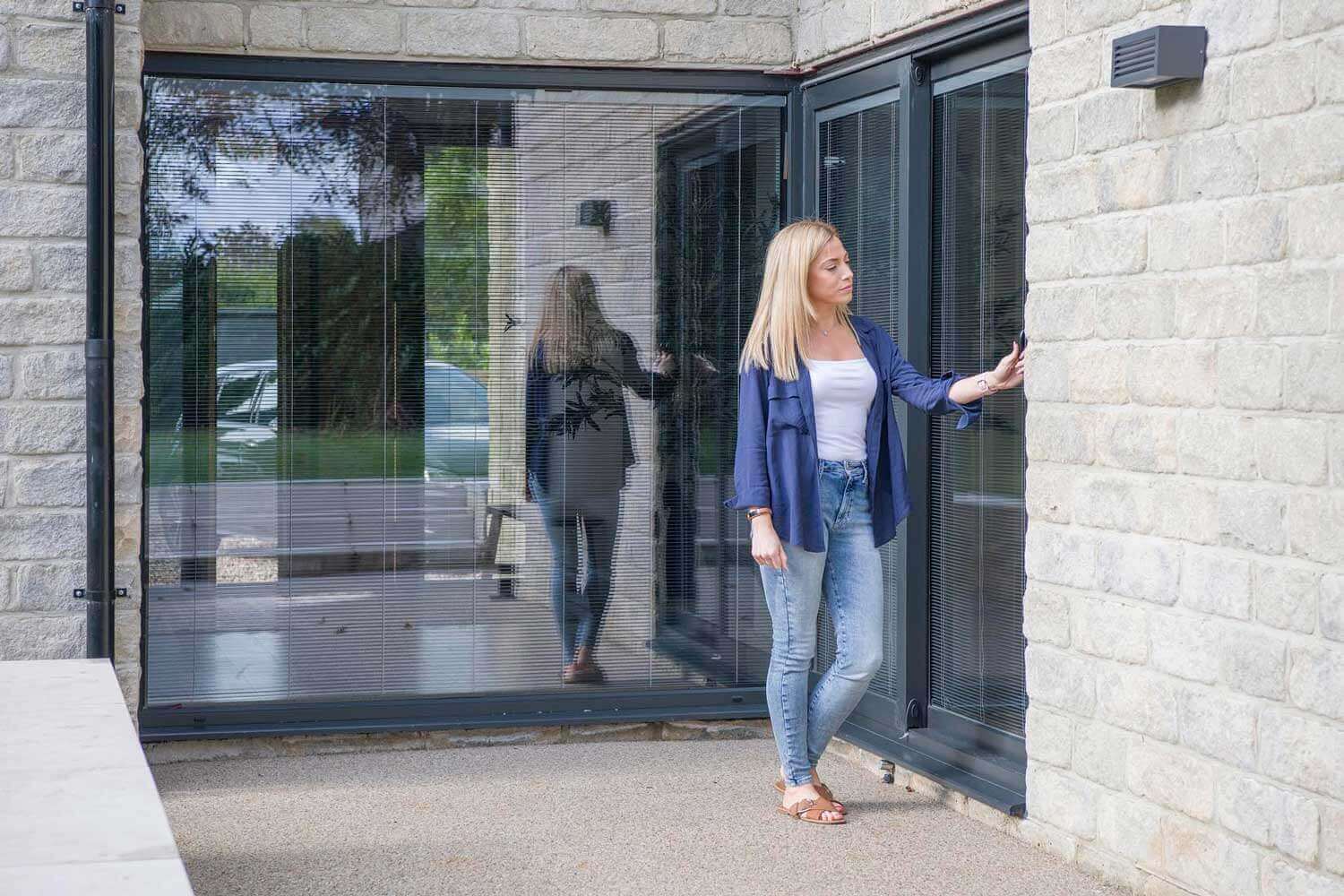 Blinds in Glass in Hatfield: operating integral blinds in the bifold doors of a stone house