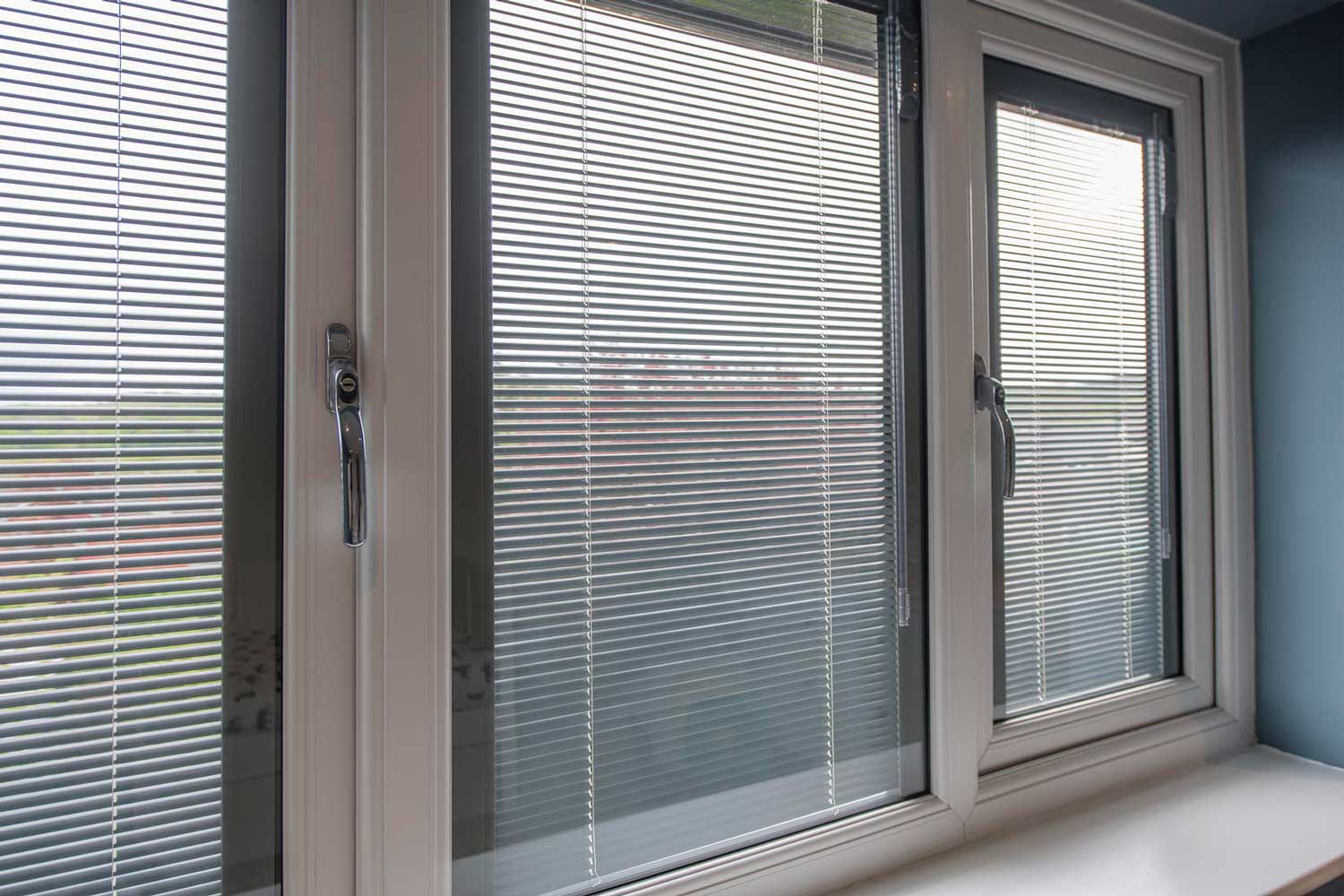 Blinds in Glass in Hatfield: white venetian integral blinds in white French doors