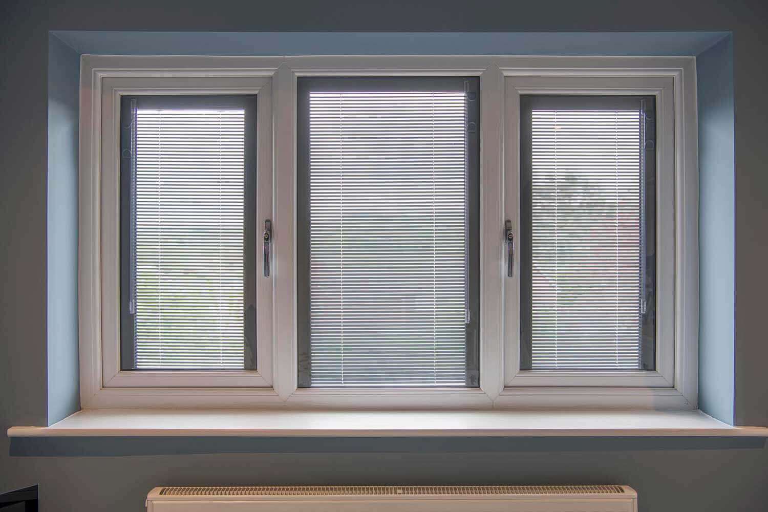 Blinds in Glass in Hatfield: white venetian integral blinds in a three-panel window